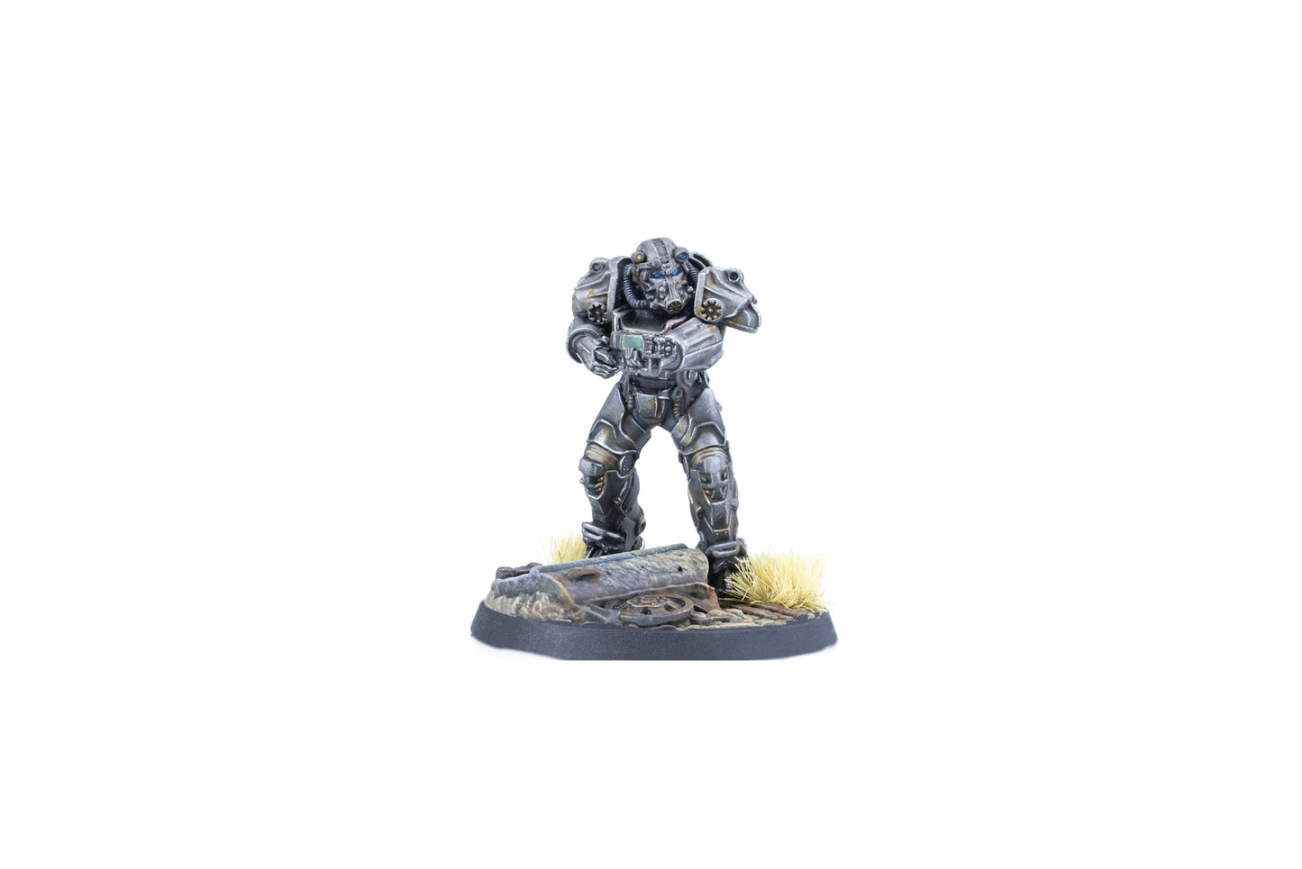 Miniature of a grey power-armored soldier holding a rifle, standing on a debris-strewn base