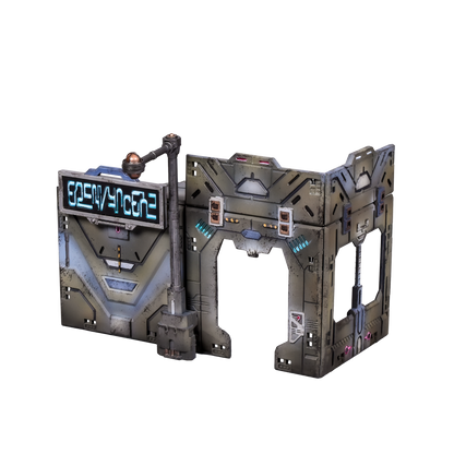 A weathered sci-fi miniature structure with a glowing digital sign and an open archway