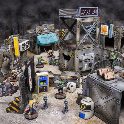 A futuristic tabletop wargame scene with detailed modular buildings and diverse armed miniatures