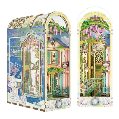 Miniature 3D book nook diorama of Monet's Giverny garden, featuring a bridge and wisteria flowers