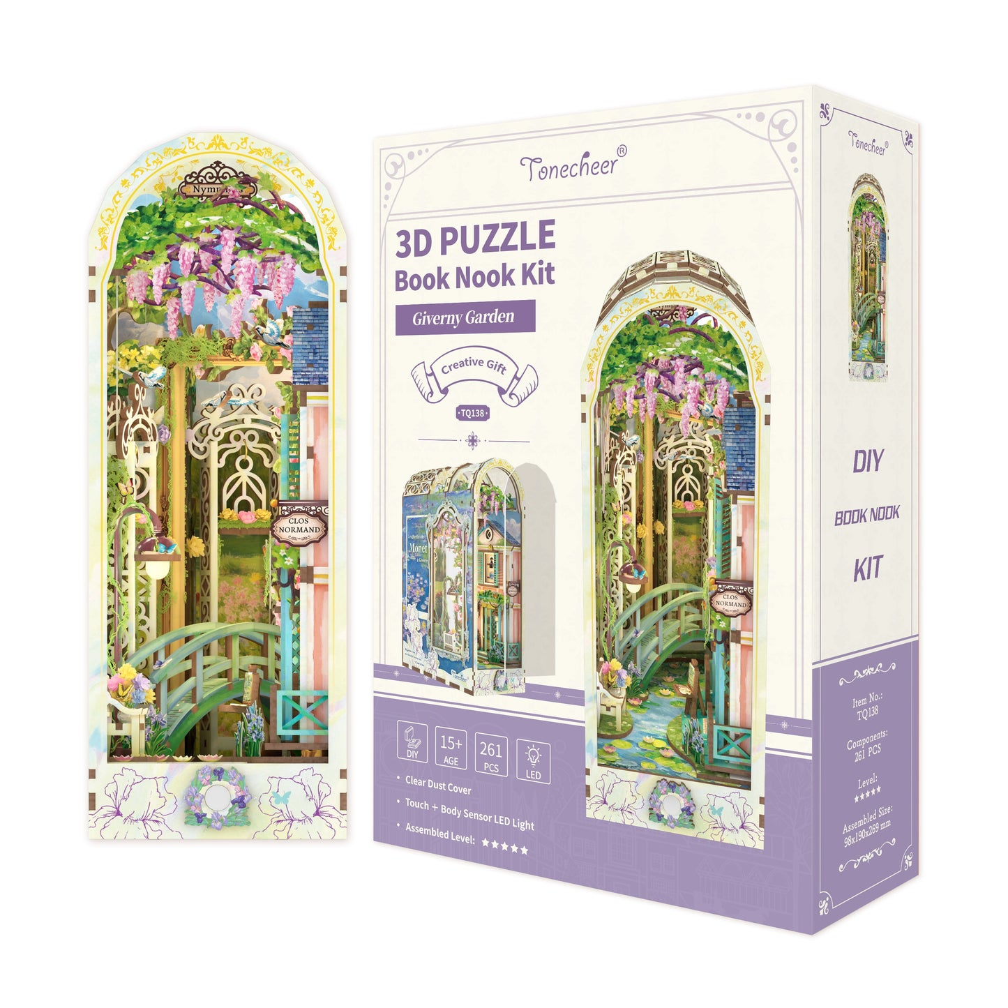 3D Puzzle Book Nook Kit box (Giverny Garden theme) showing a miniature scene with a green bridge and pink wisteria