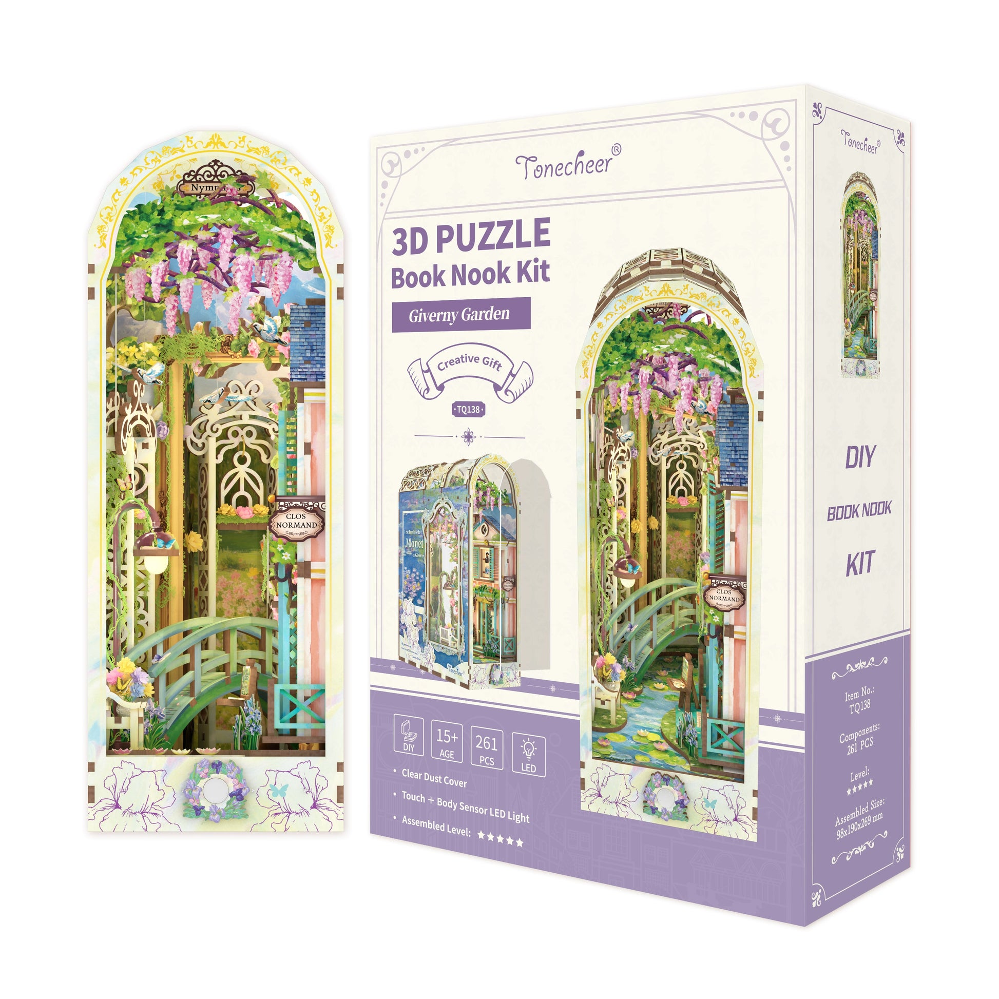 3D Puzzle Book Nook Kit box (Giverny Garden theme) showing a miniature scene with a green bridge and pink wisteria