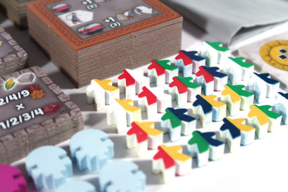 Close-up of Tawantinsuyu expansion miniatures and tokens