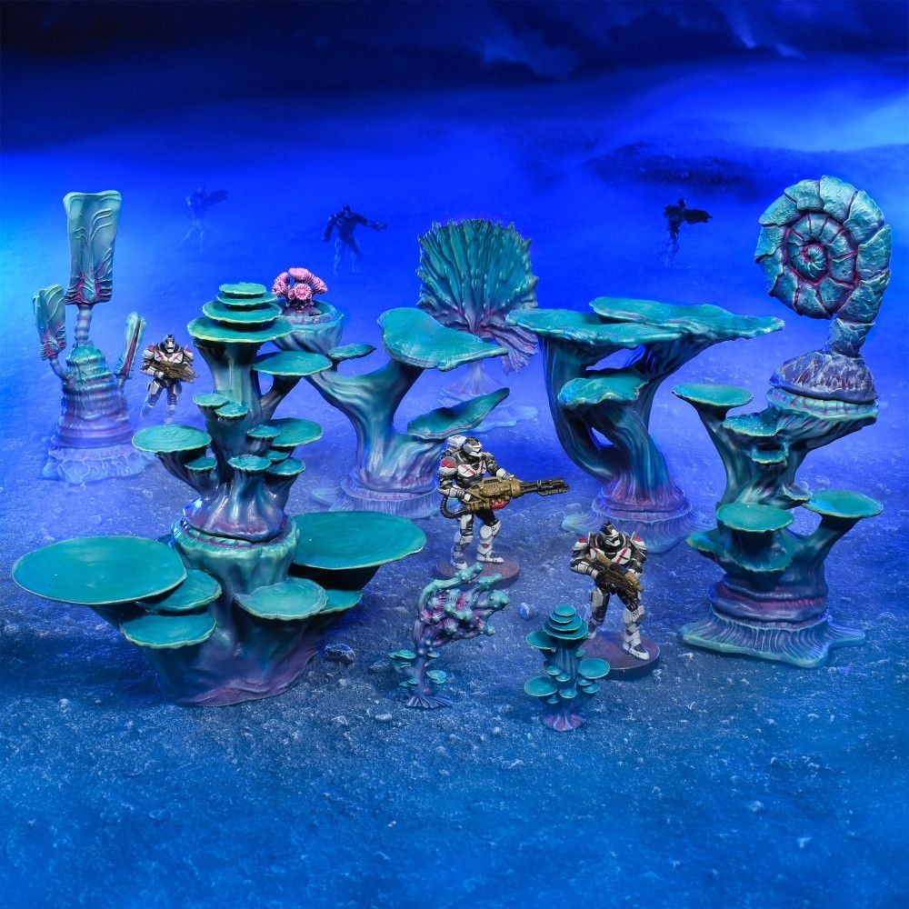 Armored sci-fi miniatures with rifles patrol a vibrant alien landscape featuring large teal-purple flora and a deep blue backdrop