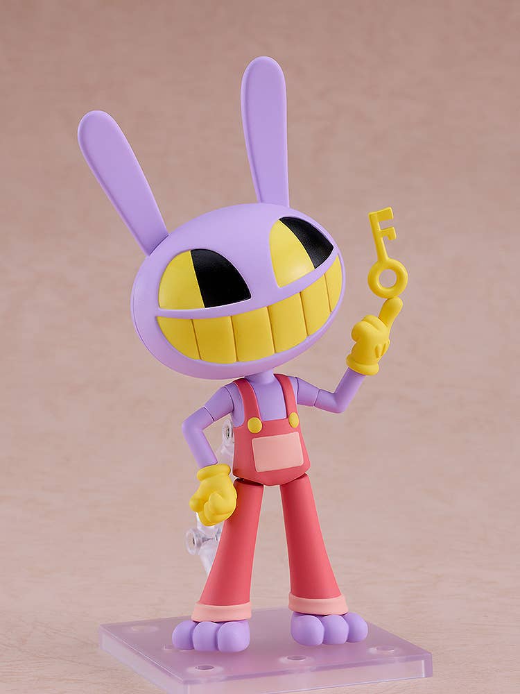 Purple rabbit-like figure with a wide yellow grin, wearing red overalls and yellow gloves, holding a yellow key