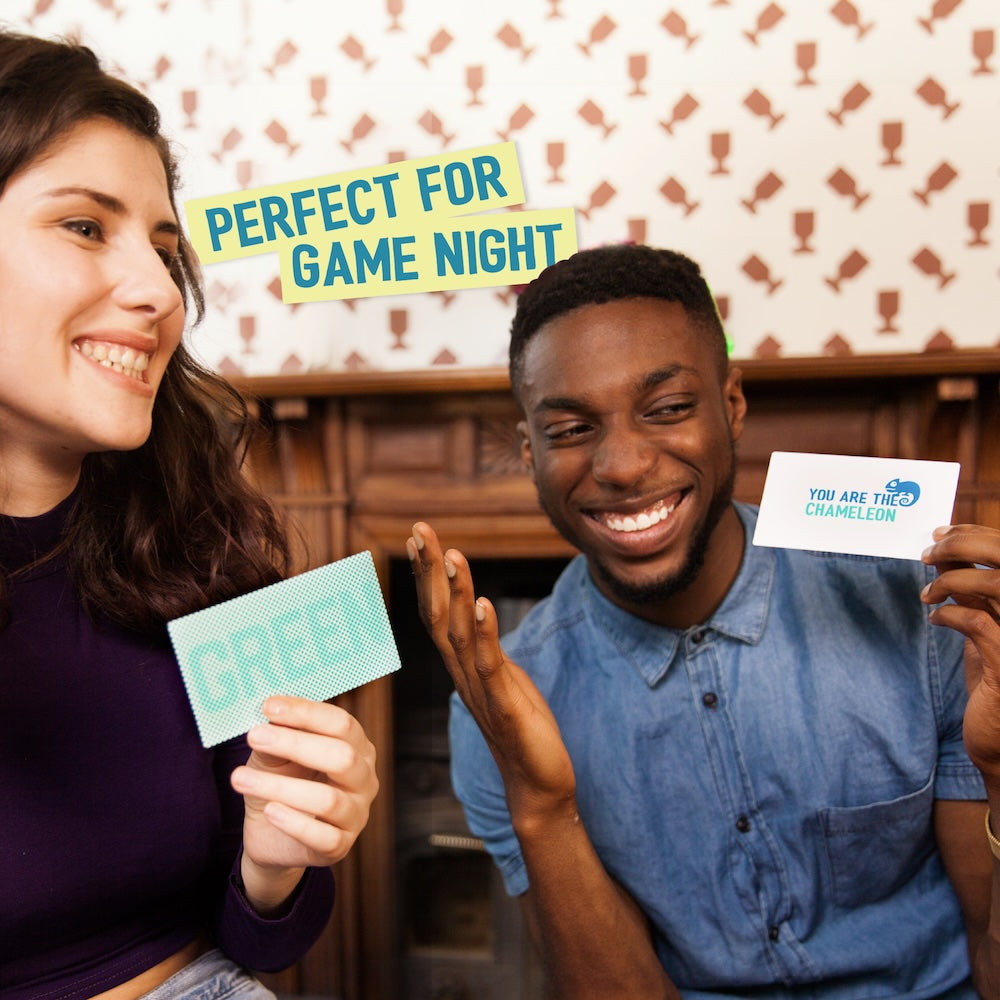 Man and woman smiling, holding game cards: 'GREEN' and 'YOU ARE THE CHAMELEON'. Overlay: 'Perfect for Game Night'