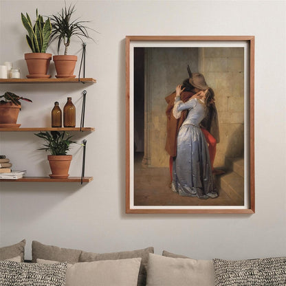 A framed painting of a couple kissing passionately hangs in a modern living room with plants on shelves