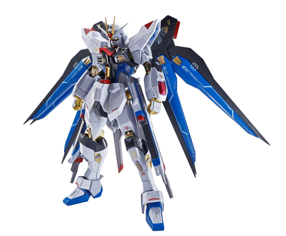 Detailed white, blue, and black Gundam model with gold accents and large deployed wings, standing