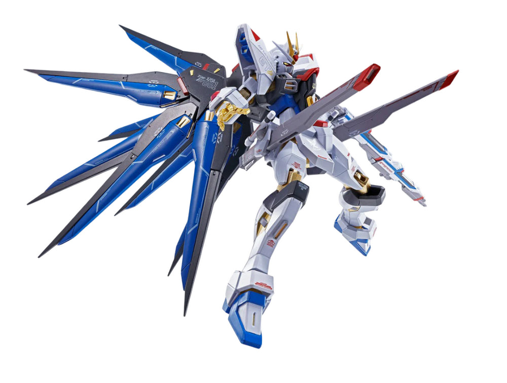 White and blue Gundam mobile suit model with prominent blue wings, holding dual beam sabers in a dynamic pose