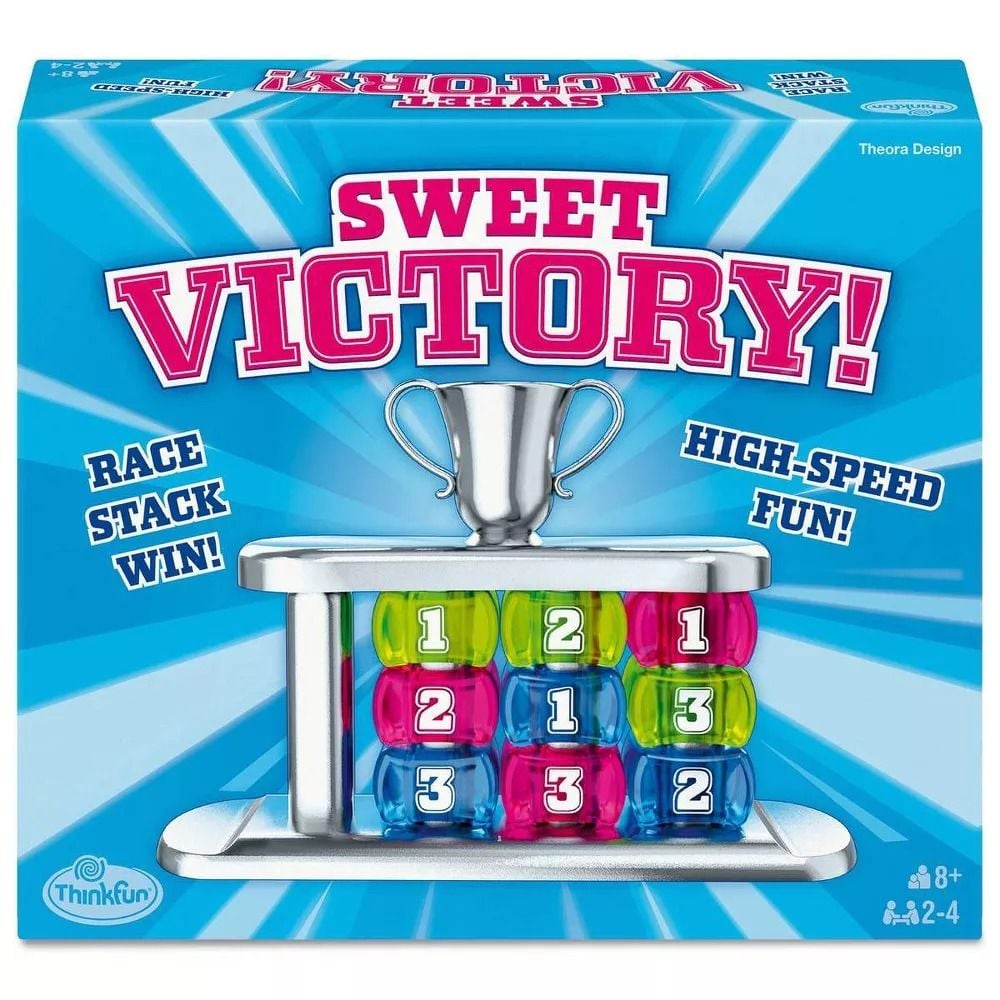 Sweet Victory board game box: blue with pink title, silver trophy, and three stacks of numbered green, pink, blue disks