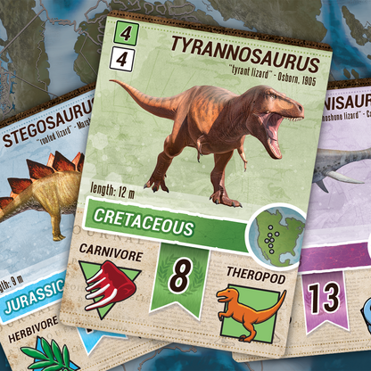 Close-up of dinosaur game cards on a map, with a roaring T-Rex card prominently displayed