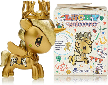 Gold Tokidoki Lucky Unicorn figurine with horseshoe crown, wings, next to its "Good Luck" themed box