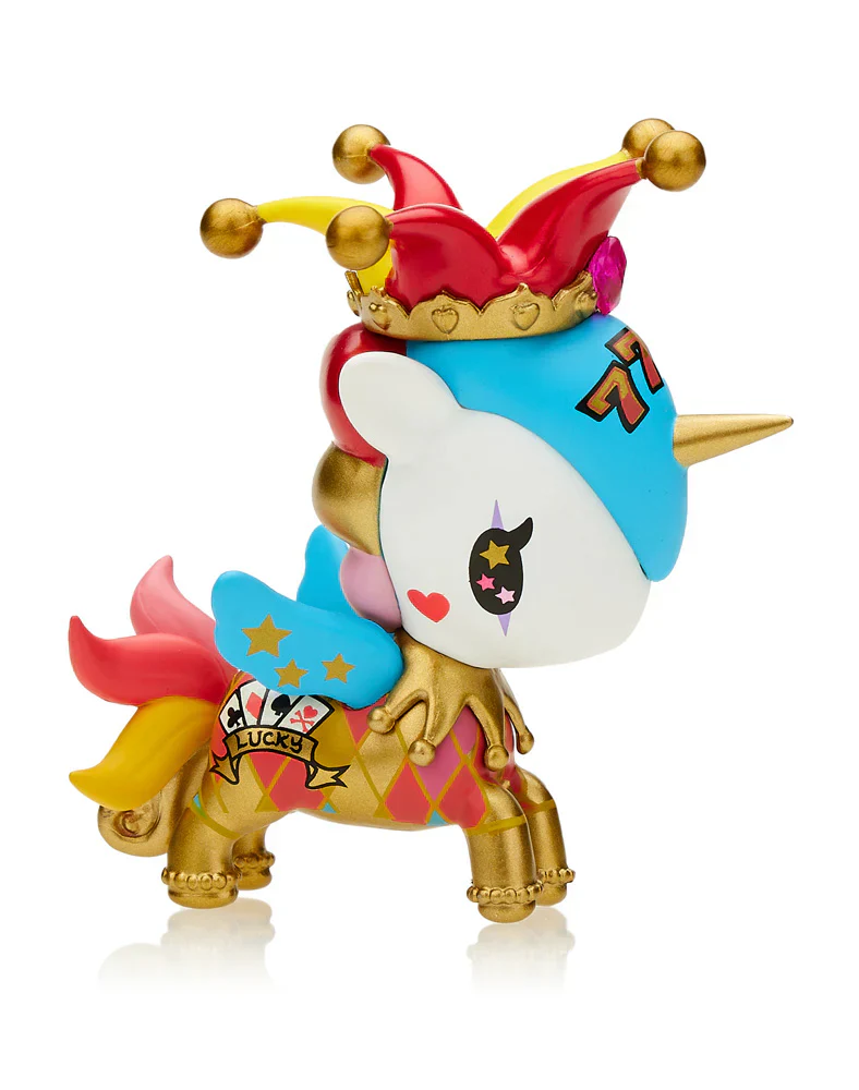 Tokidoki Unicorno figurine wearing a jester hat, with a golden horn, blue wings, and "LUCKY" banner on its harlequin body