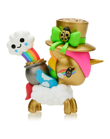 A gold unicorn toy with a top hat, green bow, and ladybug, featuring a rainbow from a pot of gold on its back
