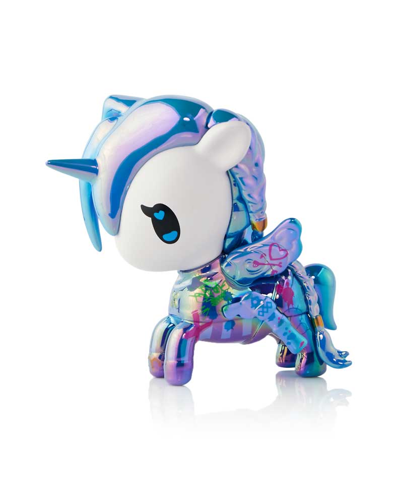 Iridescent blue-purple Tokidoki Unicorno figure with white face, horn, wings, and colorful body patterns, standing