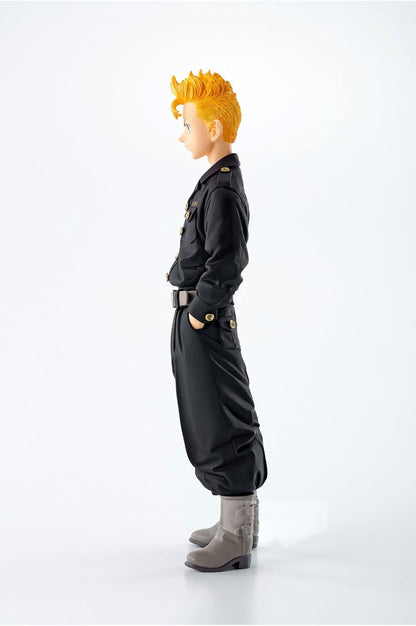 Side view of an anime male figurine with spiky orange hair, wearing a black uniform with gold buttons and grey boots