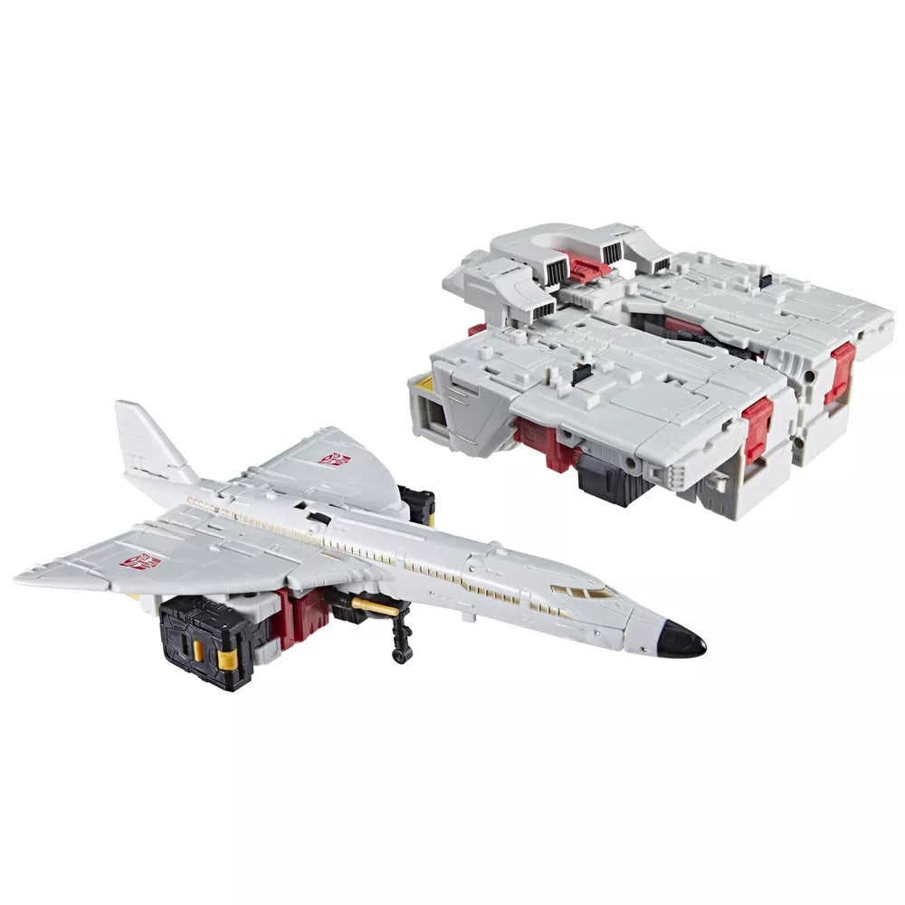 White Transformers jet with red Autobot symbols next to its bulky, blocky alternate mode