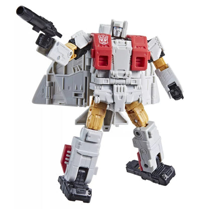 Grey and red Autobot Transformer robot toy, standing and holding a black blaster with its arm raised