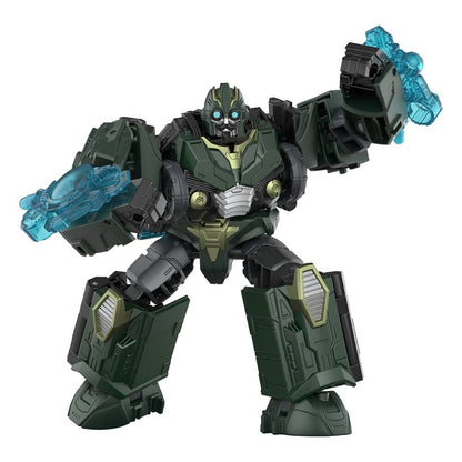 A dark green Transformer robot with glowing blue eyes holds translucent blue energy blasts in both hands, poised dynamically