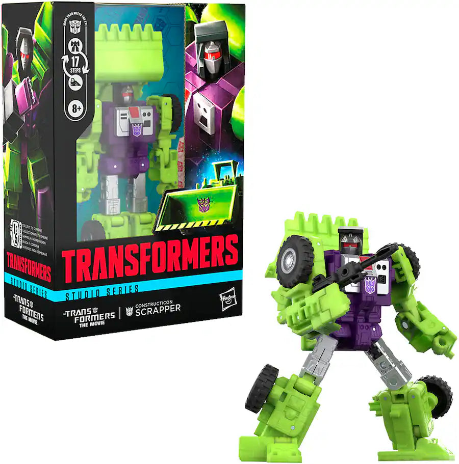 Green and purple Transformers Constructicon Scrapper action figure posed with a gun, next to its packaging