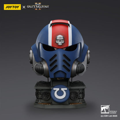 Blue Ultramarines Space Marine helmet bust with a red stripe, silver skull, and omega symbol on its base