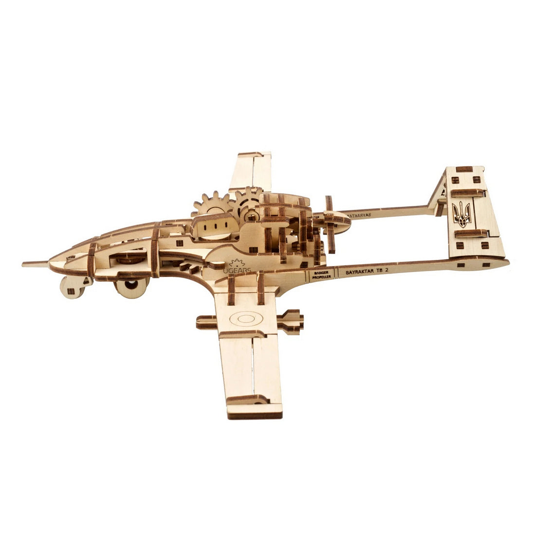 UGEARS wooden Bayraktar TB 2 drone model, with visible gears and a Ukrainian trident on the tail