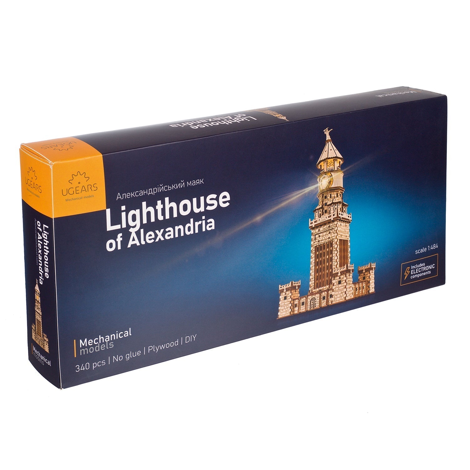 UGEARS Lighthouse of Alexandria mechanical model kit box, featuring the completed, lit-up wooden lighthouse