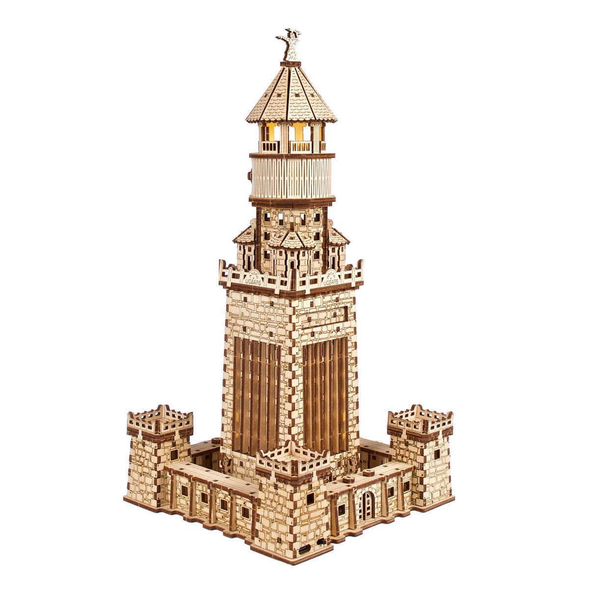 Intricate wooden model of the Lighthouse of Alexandria with a light glowing at its top