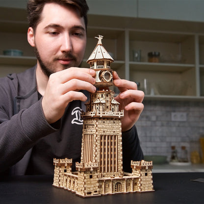 A man assembling a detailed wooden 3D puzzle resembling a fortified lighthouse