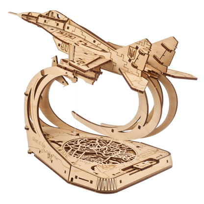 Wooden model of a fighter jet with Ukrainian trident, number "91", and "Ghost of Kyiv" text, mounted on a stand over a city map