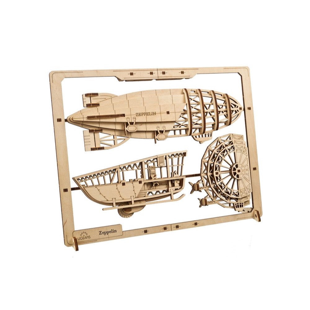 Unassembled laser-cut wooden Zeppelin model kit, with all parts still attached to the sheet