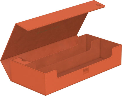 Open peach deck box with magnetic lid, showing three card slots and a separate small accessory compartment