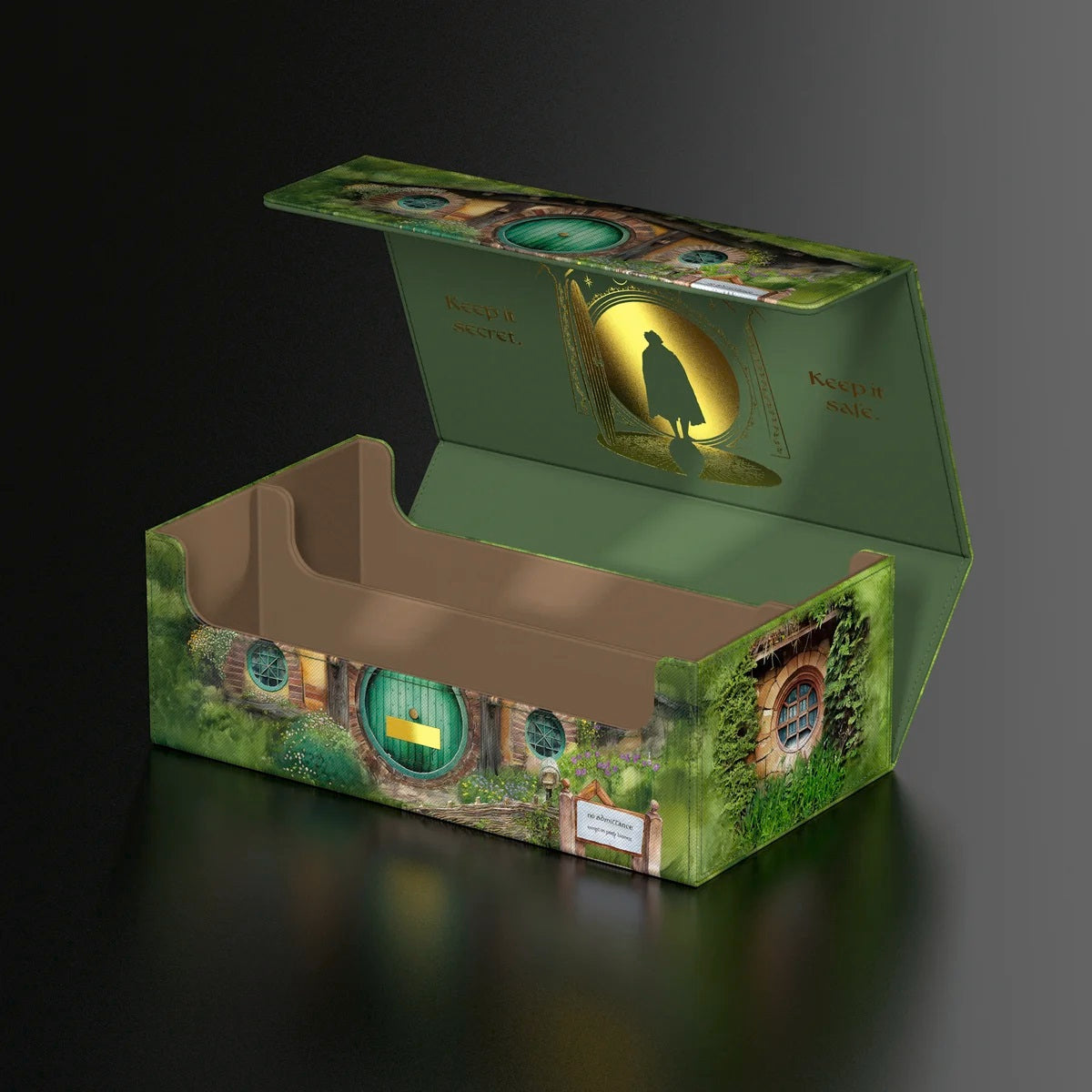 Open green deck box styled like Bag End, featuring a gold silhouette and the text "Keep it secret. Keep it safe.