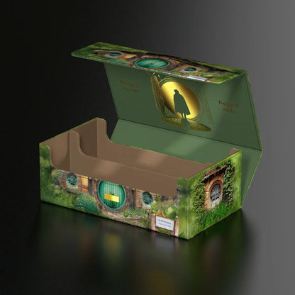 Open green deck box styled like Bag End, featuring a gold silhouette and the text "Keep it secret. Keep it safe.