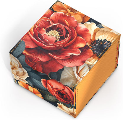 Decorative cube box, red and orange floral pattern on dark background, with cream accents and stitched orange edges