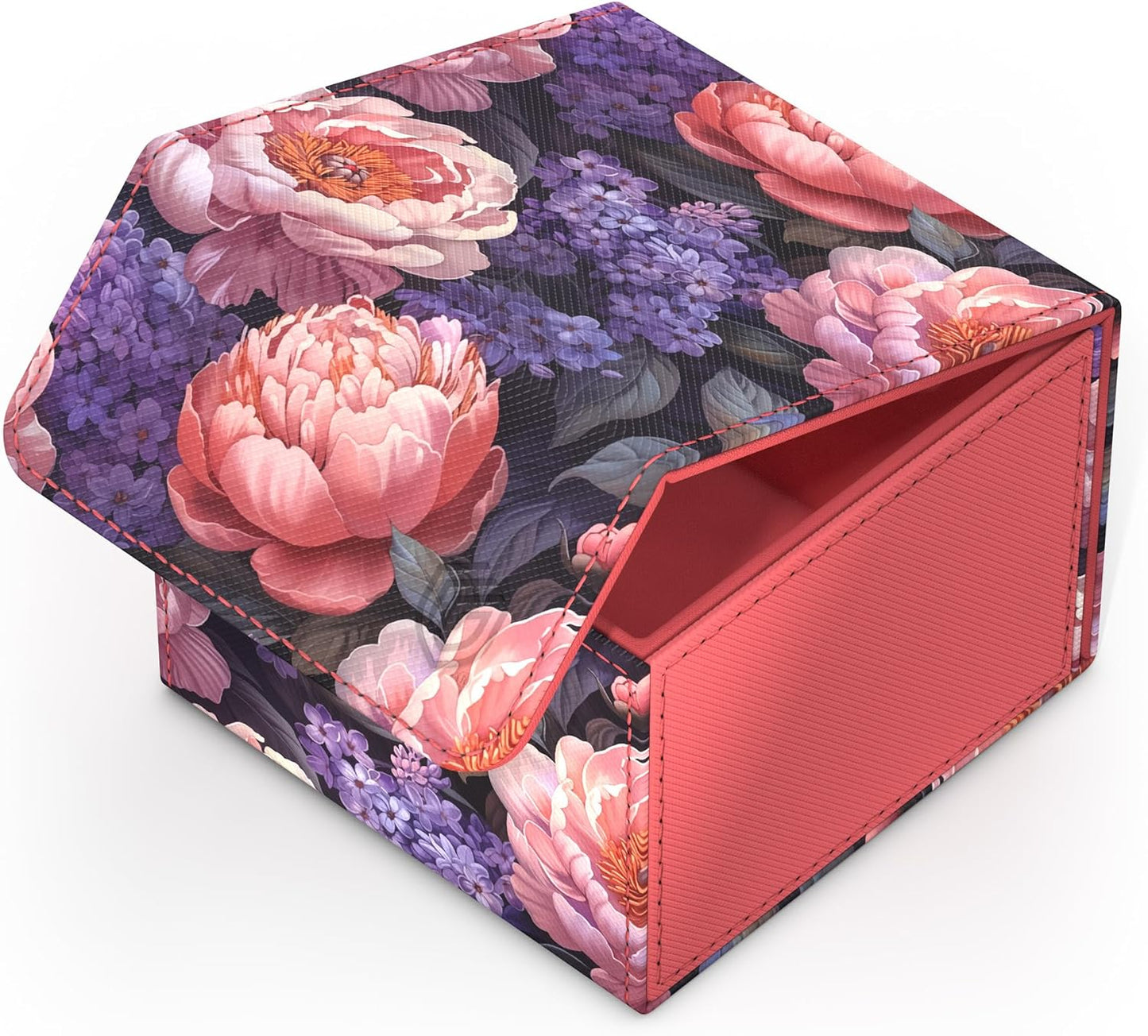Floral box with pink peonies and purple flowers on a dark background, its lid partially open to reveal a coral interior