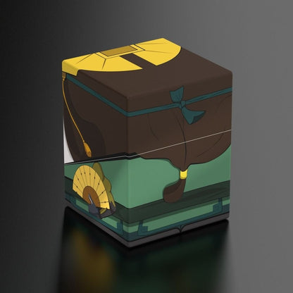 Stylized brown and green cube box featuring anime-style robe details, a yellow fan, and headpiece accents