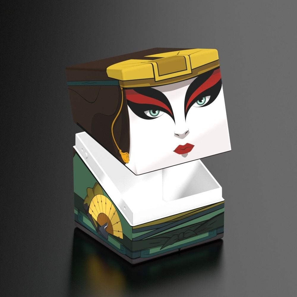 Open box lid featuring the stylized face of Kyoshi (white makeup, red markings) over a green, decorated base