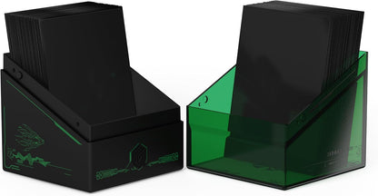 Two card deck boxes: one opaque black with green tech designs, one translucent dark green. Both filled with black cards.