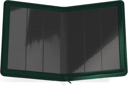 An open dark green zippered binder, showing empty clear sleeves for cards
