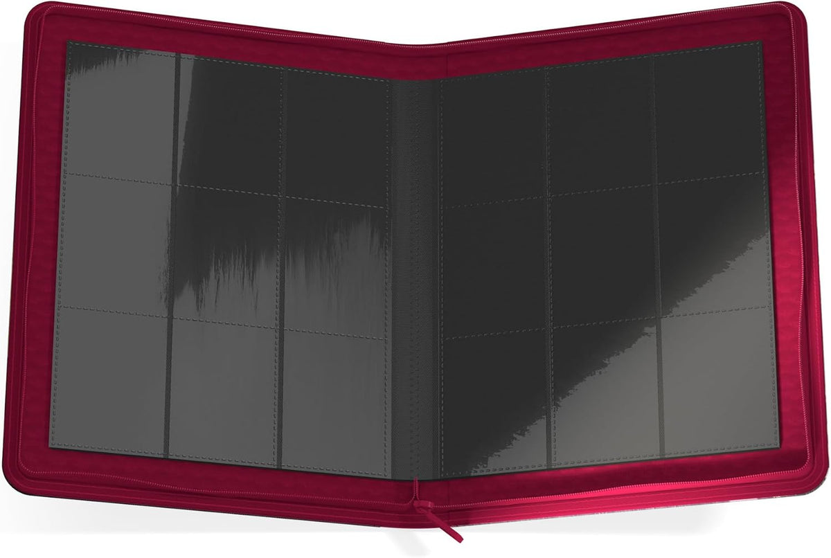 Open deep red collector&#39;s binder showing empty black pocket pages for cards