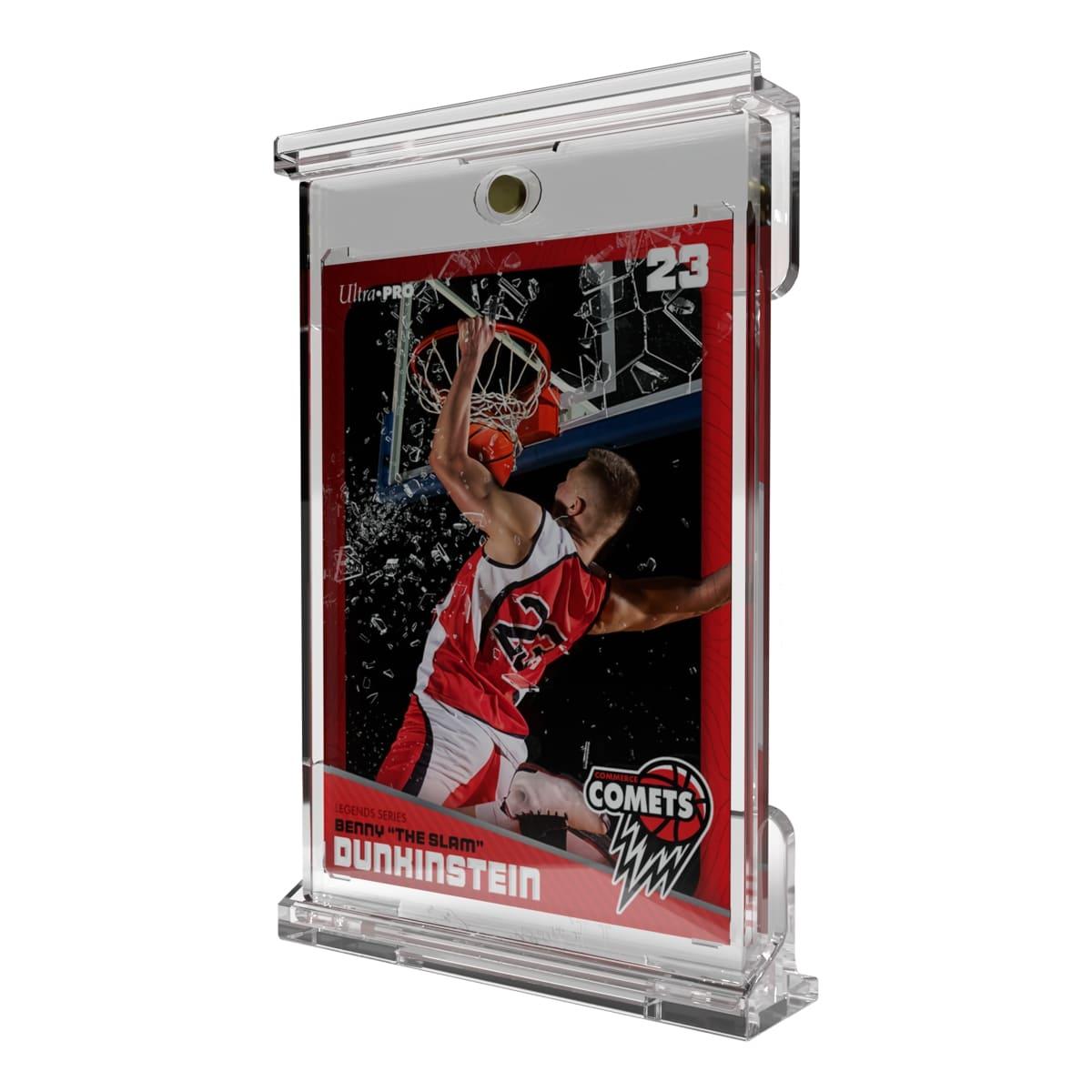 A red-framed basketball trading card of a player dunking amidst shattered glass, in a clear display case