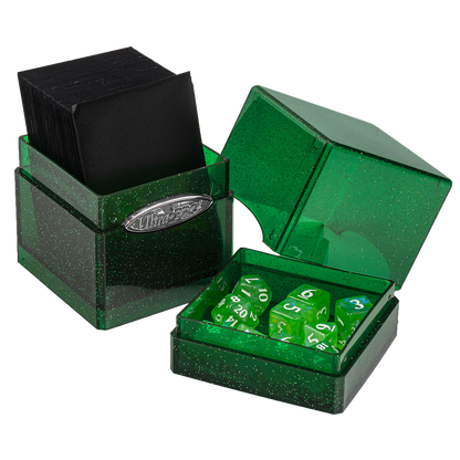 Green glitter dual-compartment gaming box holding black cards and a set of green polyhedral dice.