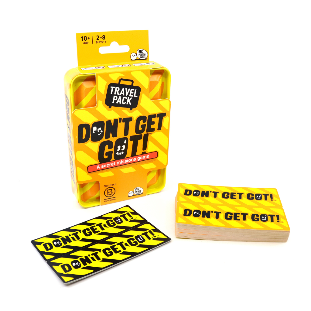 Don&#39;t Get Got Travel Pack secret missions game with vibrant yellow and black packaging showing mission cards and game box on white background