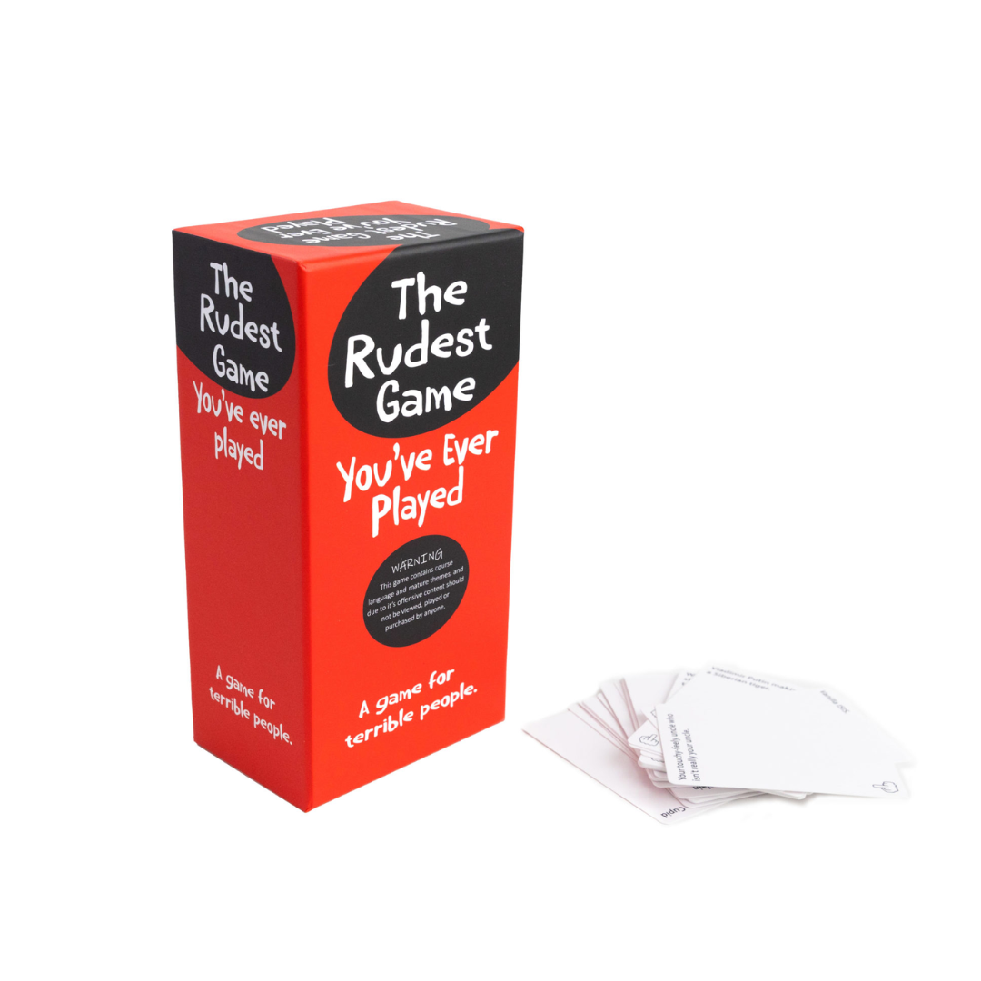 A red and black box for &quot;The Rudest Game You&#39;ve Ever Played&quot; stands next to a fanned stack of white game cards