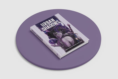 Urban Shadows Core Book displayed on a purple disc, Cover shows a woman with curly hair holding a glowing orb and sword