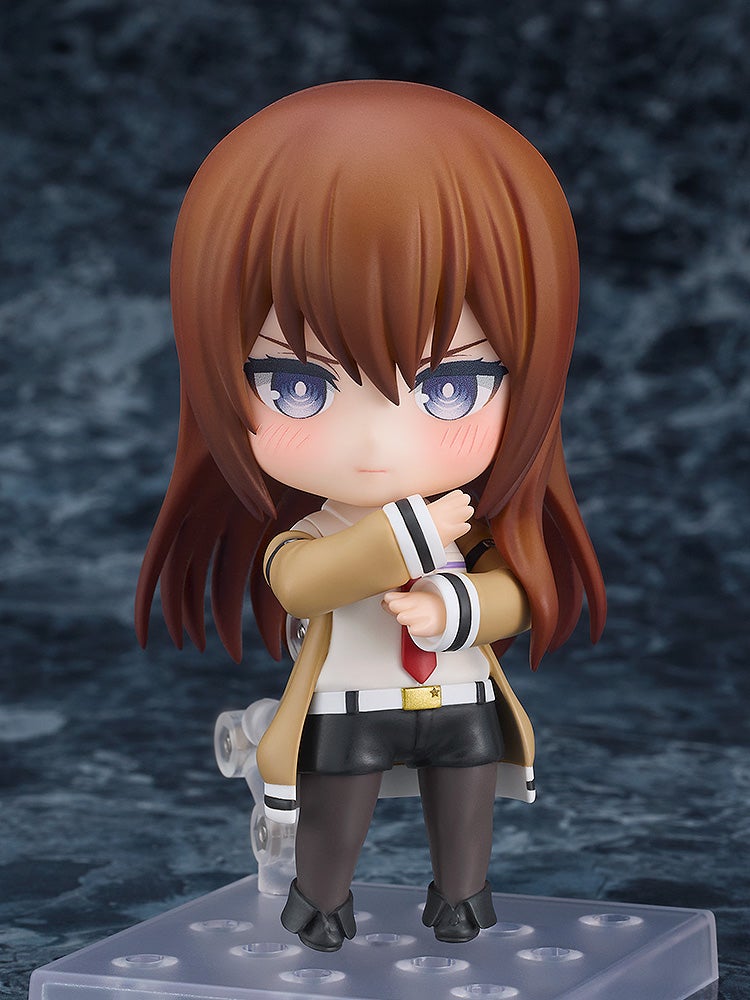 Nendoroid figure of Makise Kurisu from SteinsGate in a tan lab coat with dark hair and purple eyes