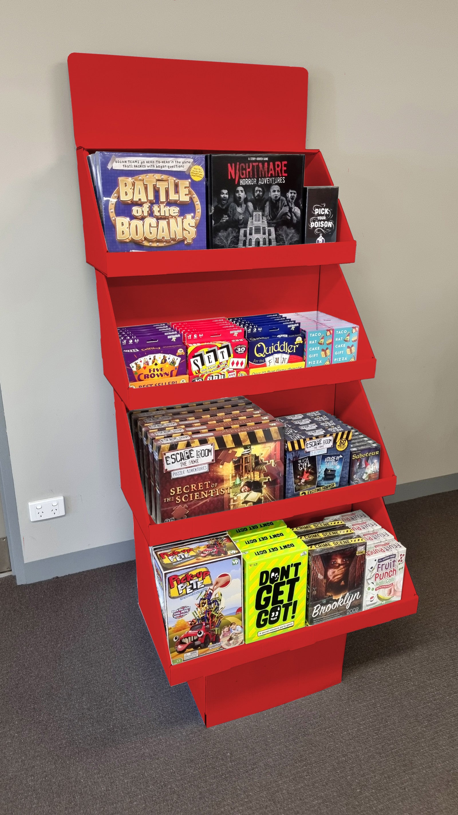 Red multi-tiered display stand placed in store