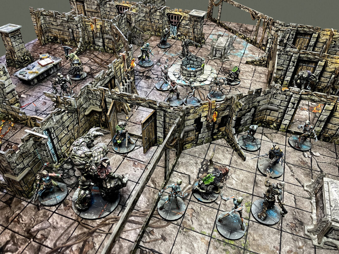 Battle Systems Vaults of Enveron Core Set dungeon terrain with miniature fantasy figures detailed stone walls well and rubble for tabletop RPGs