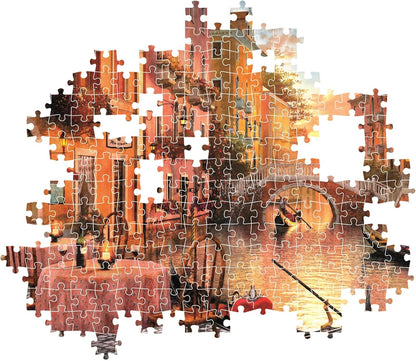 An incomplete jigsaw puzzle depicting a Venetian canal scene at sunset with gondolas, buildings, and a bridge